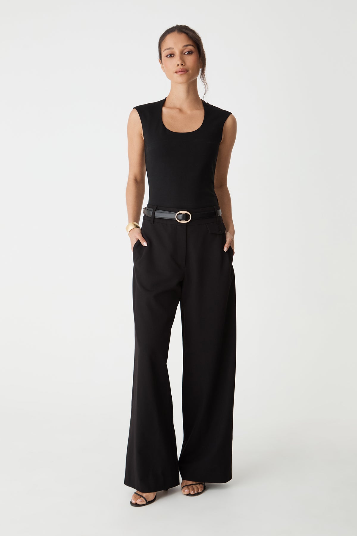 Soho Scoop Neck Top in black, front view worn with black wide-leg pants and belt