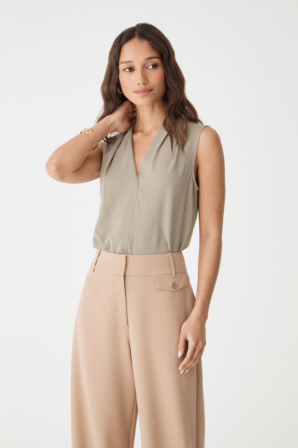 Front view close-up of the khaki Alivia 2 V-Neck Top showing V-neckline and shoulder pleats