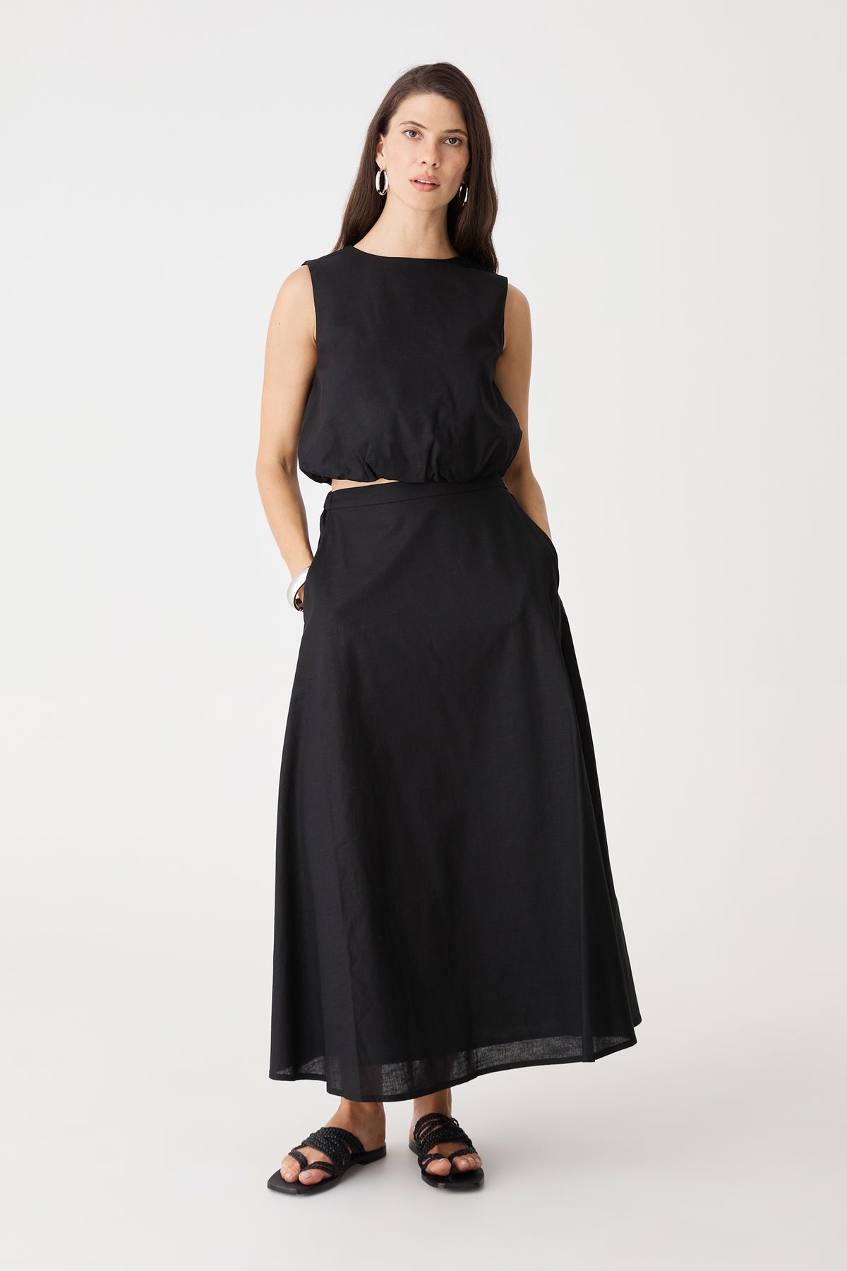 Kenya Linen Skirt in black, front view, worn with matching sleeveless Kenya Ruched Linen Top