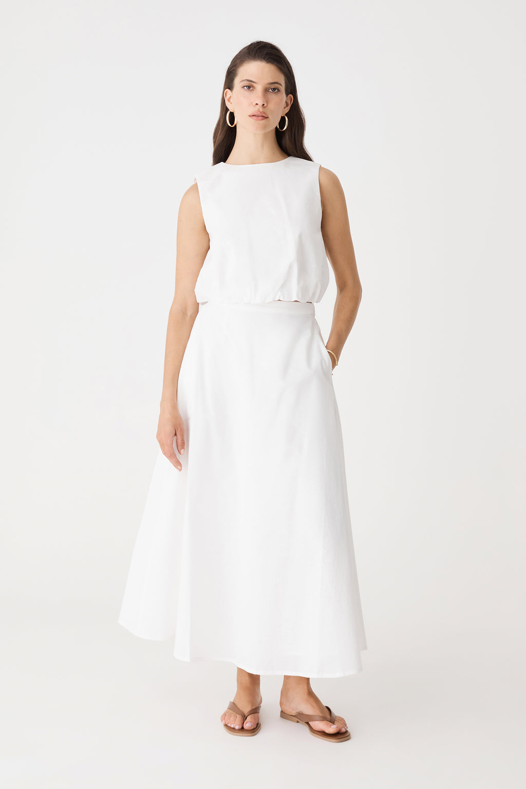 Kenya Linen Skirt in ivory, front view worn with matching sleeveless ivory top and tan sandals