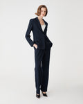 Merid Single Breasted Blazer in navy, side-on full-length view worn with matching navy tailored pants