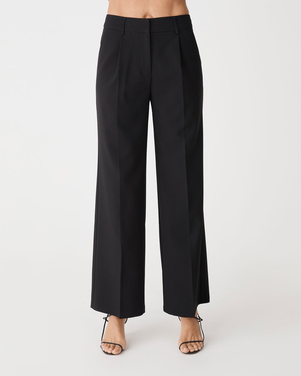 Front view of the black Nikki Tailored Pants, high waisted wide straight leg with front pleats