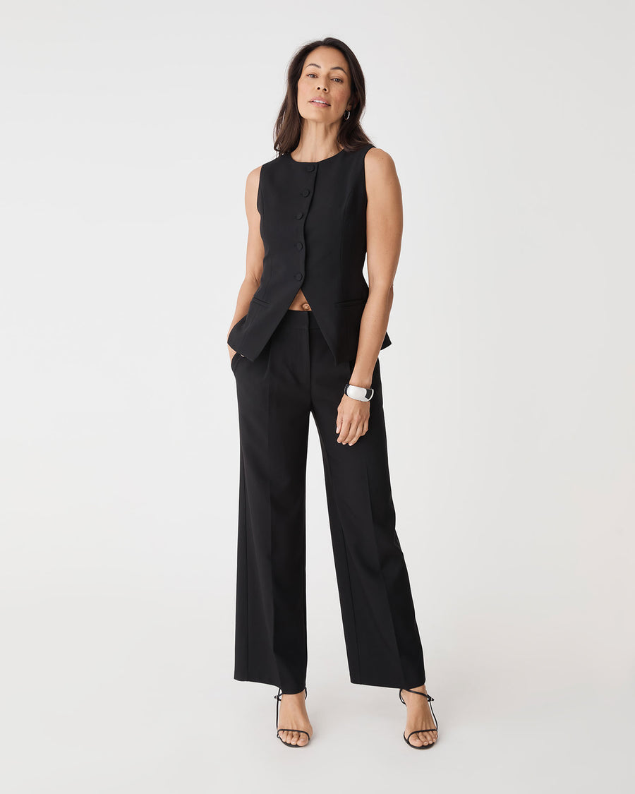 Nikki Tailored Pants in black, front view worn with matching black vest and heeled sandals