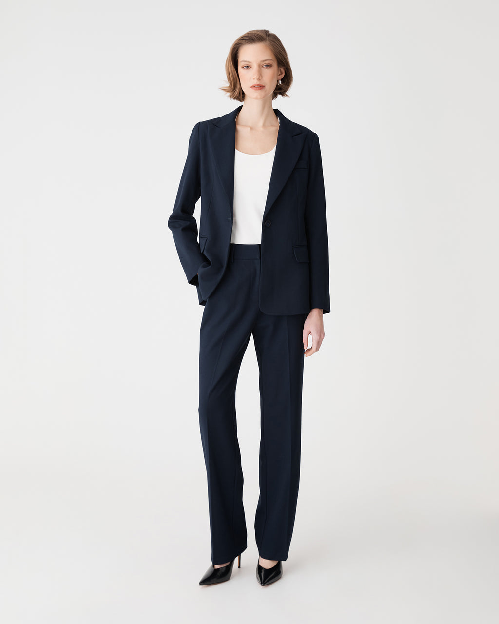 Merid Tailored Pants in navy, front view, worn with matching navy blazer and white top