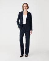 Merid Tailored Pants in navy, front view, worn with matching navy blazer and white top