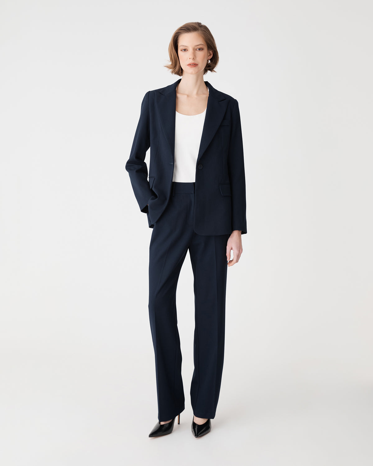 Merid Tailored Pants in navy, front view, worn with matching navy blazer and white top