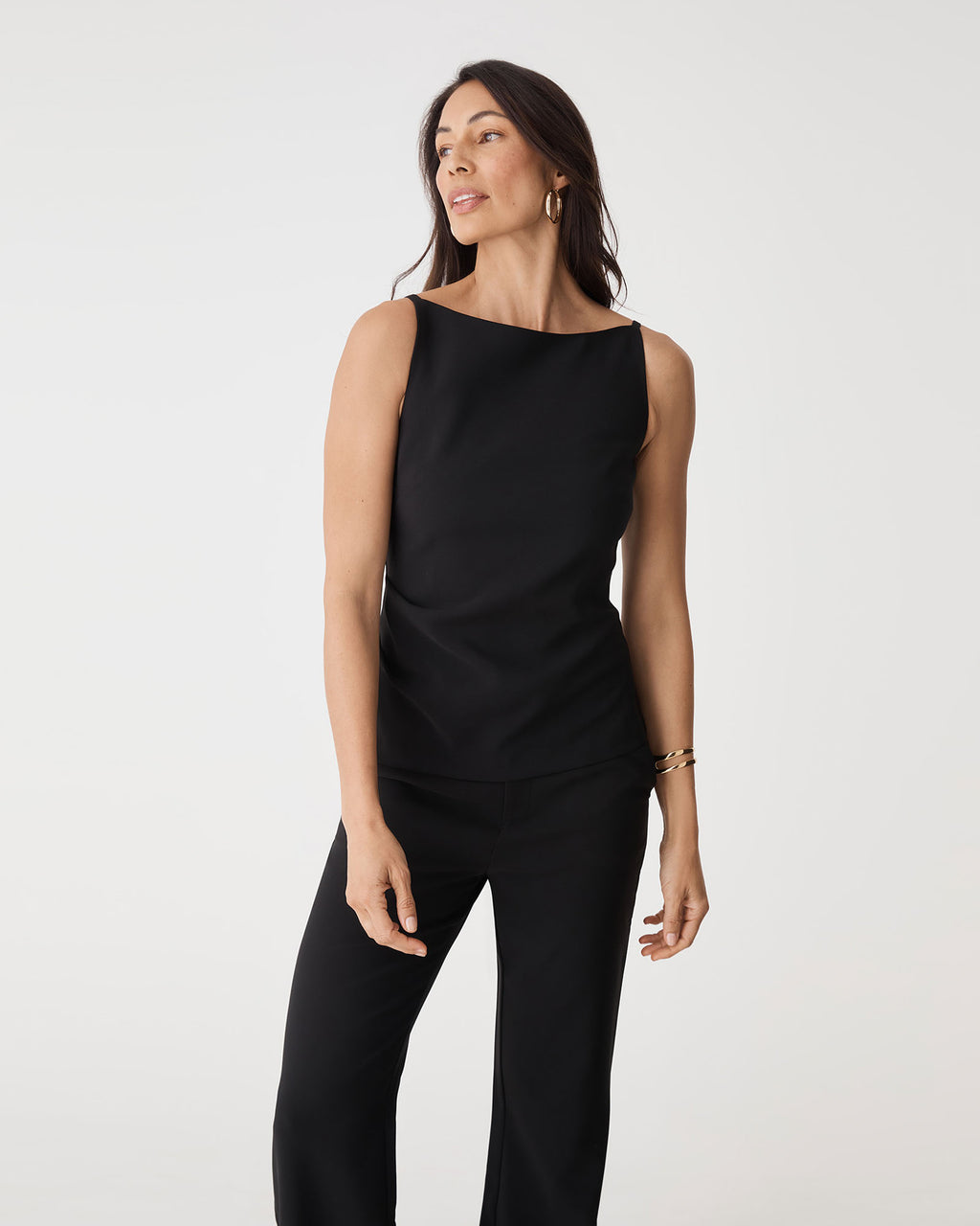 Front close view of the black Hannah Apron Top showing boat neckline and side ruching