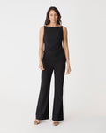Hannah Apron Top in black, front view worn with matching black bootleg pants