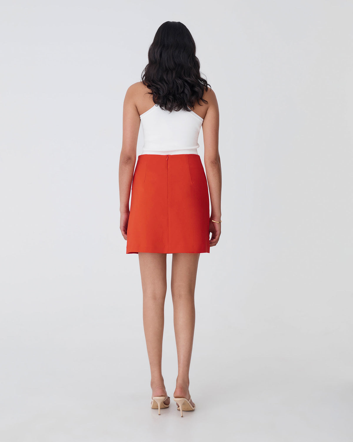 Kinsley Tailored Mini Skirt in vermilion — back view