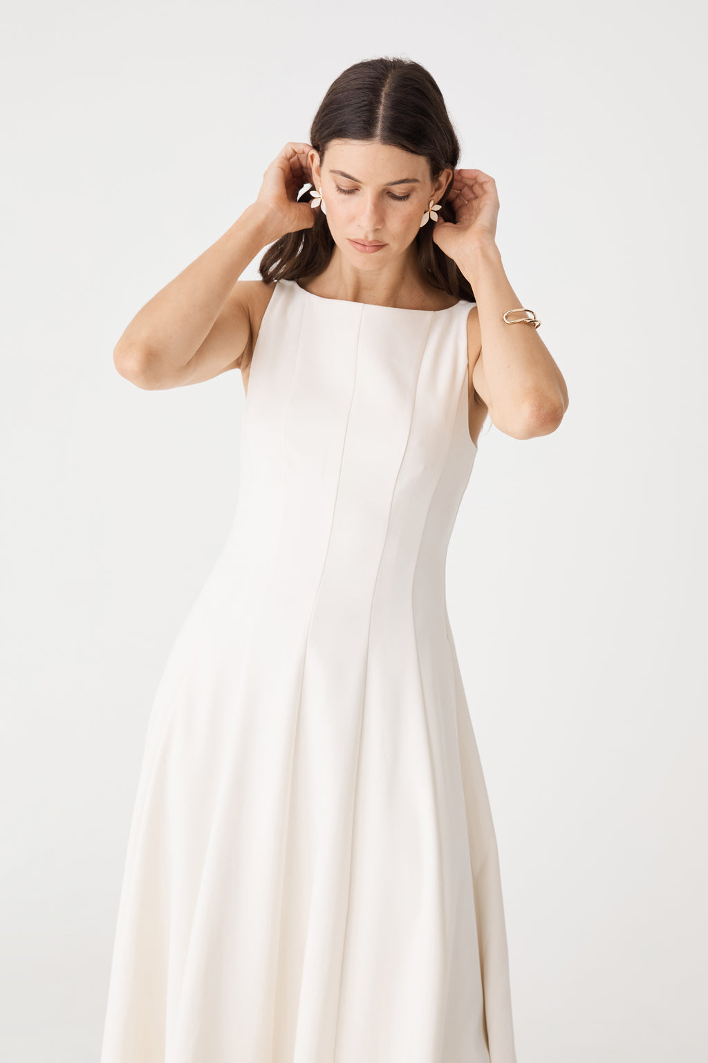 Close-up front view of the cream Sally Panel Midi Dress showing boat neckline and panel seams