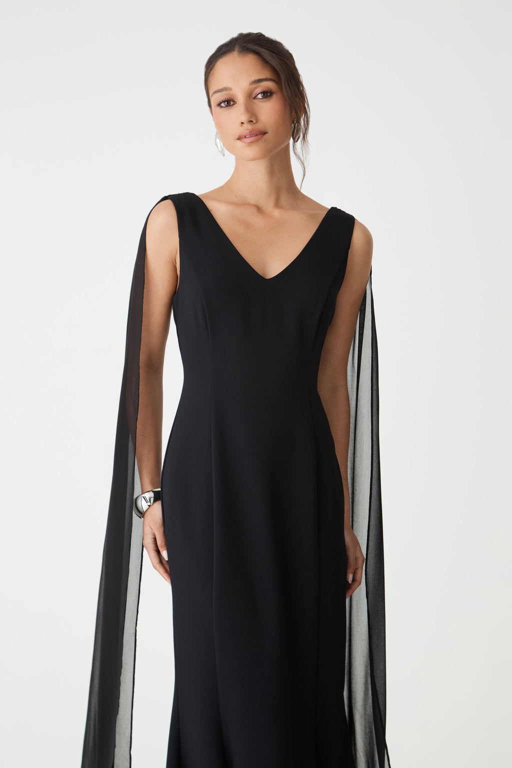 Close-up of the sheer chiffon shoulder scarf falling from the shoulder