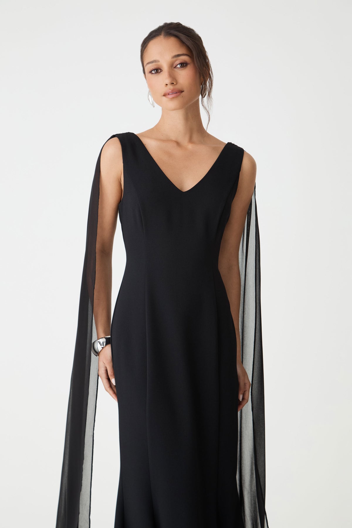 Close-up of the sheer chiffon shoulder scarf falling from the shoulder