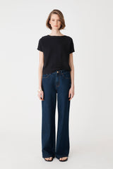Brandy Relaxed Cotton Knit Top in black, front view worn with dark blue wide-leg jeans