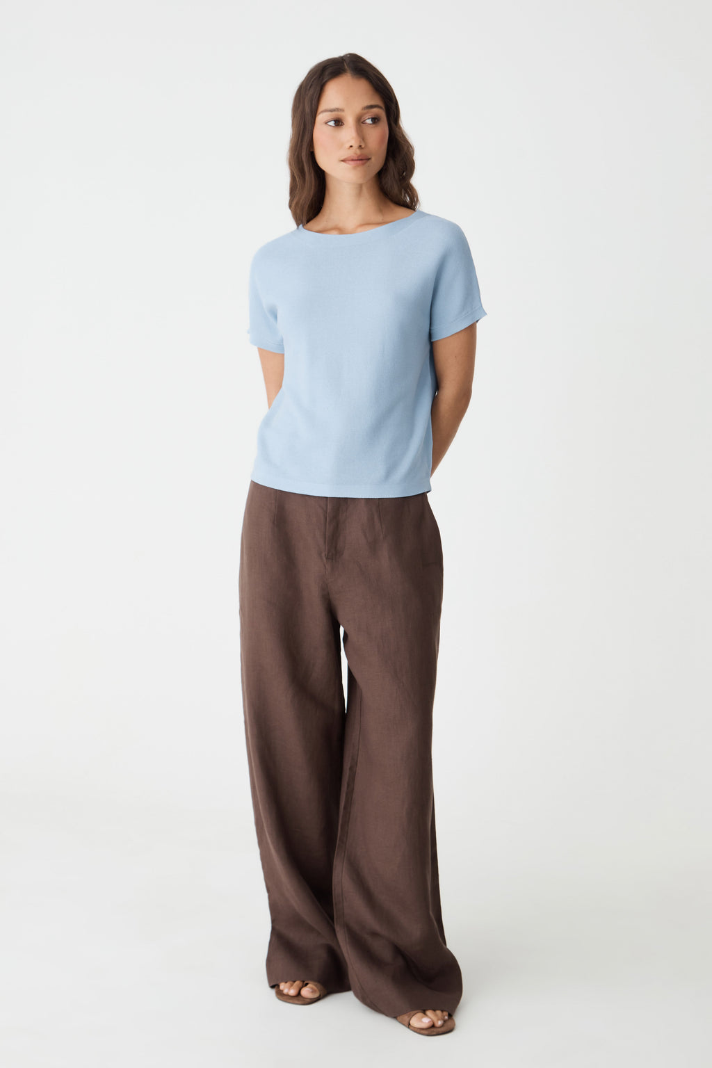 Brandy Relaxed Cotton Knit Top in powder blue, front view worn with brown wide-leg trousers