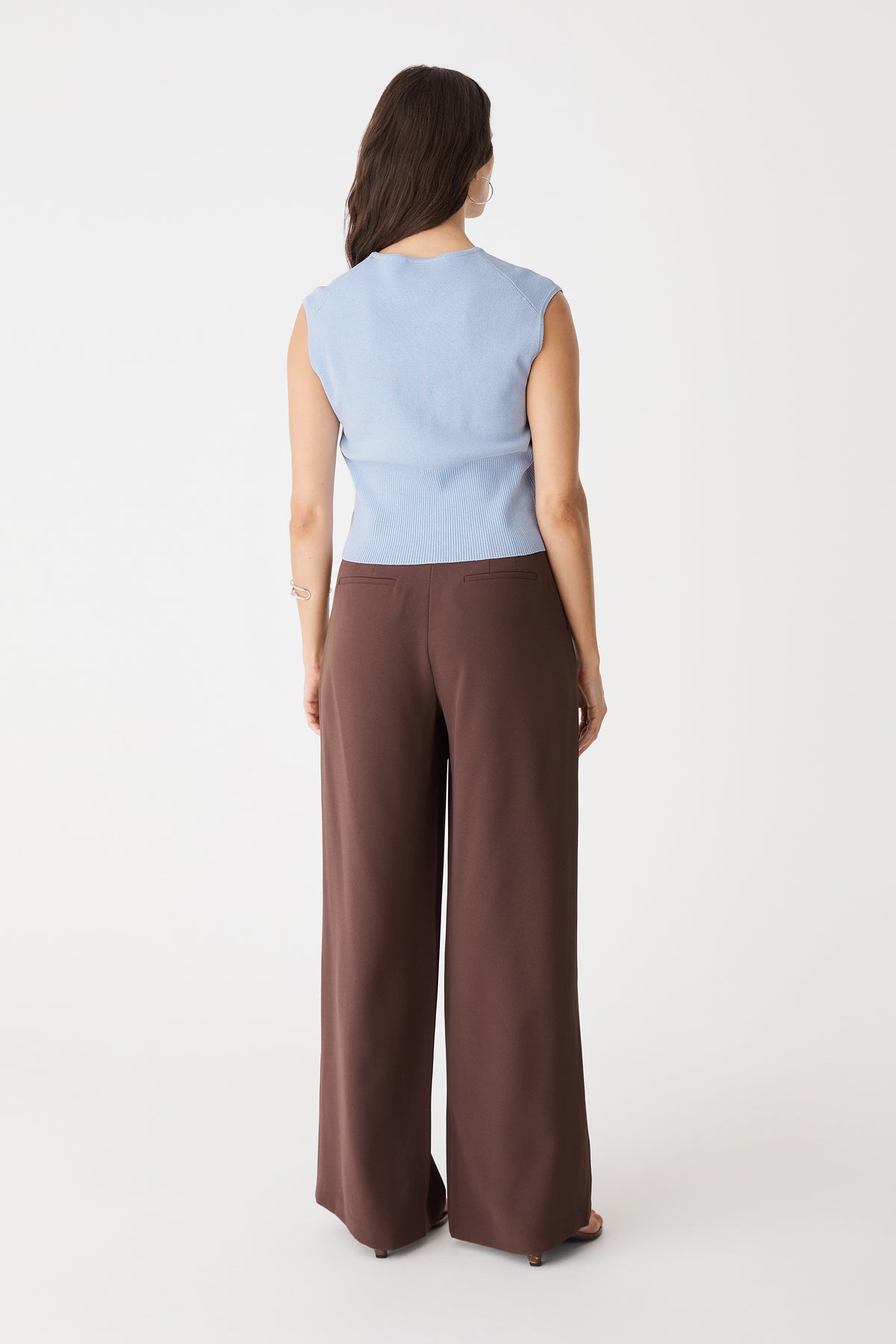 Back view of the Sky Blue sleeveless knit top with contrast ribbed hem