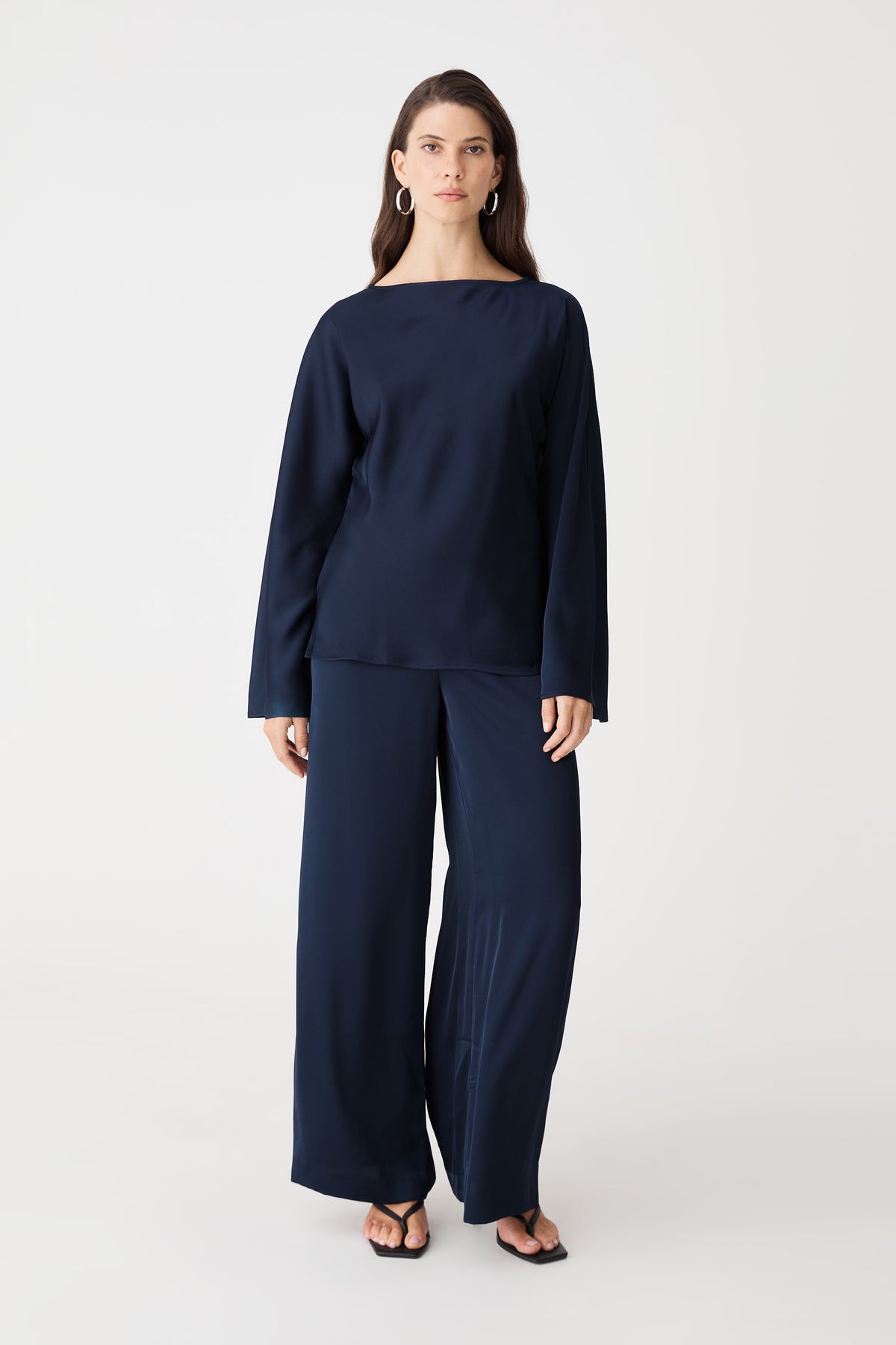 Asma Satin Wide Leg Pants in navy, front view, worn with matching navy satin long-sleeve top