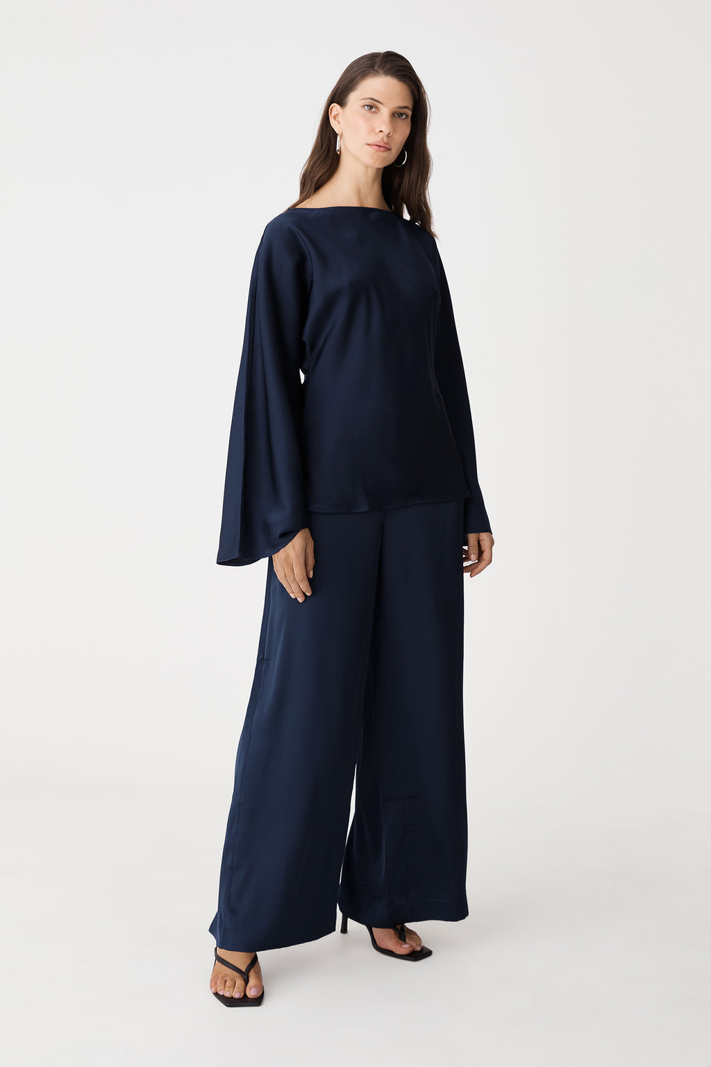 Front view of the navy satin wide-leg pants and matching top, full length to the floor