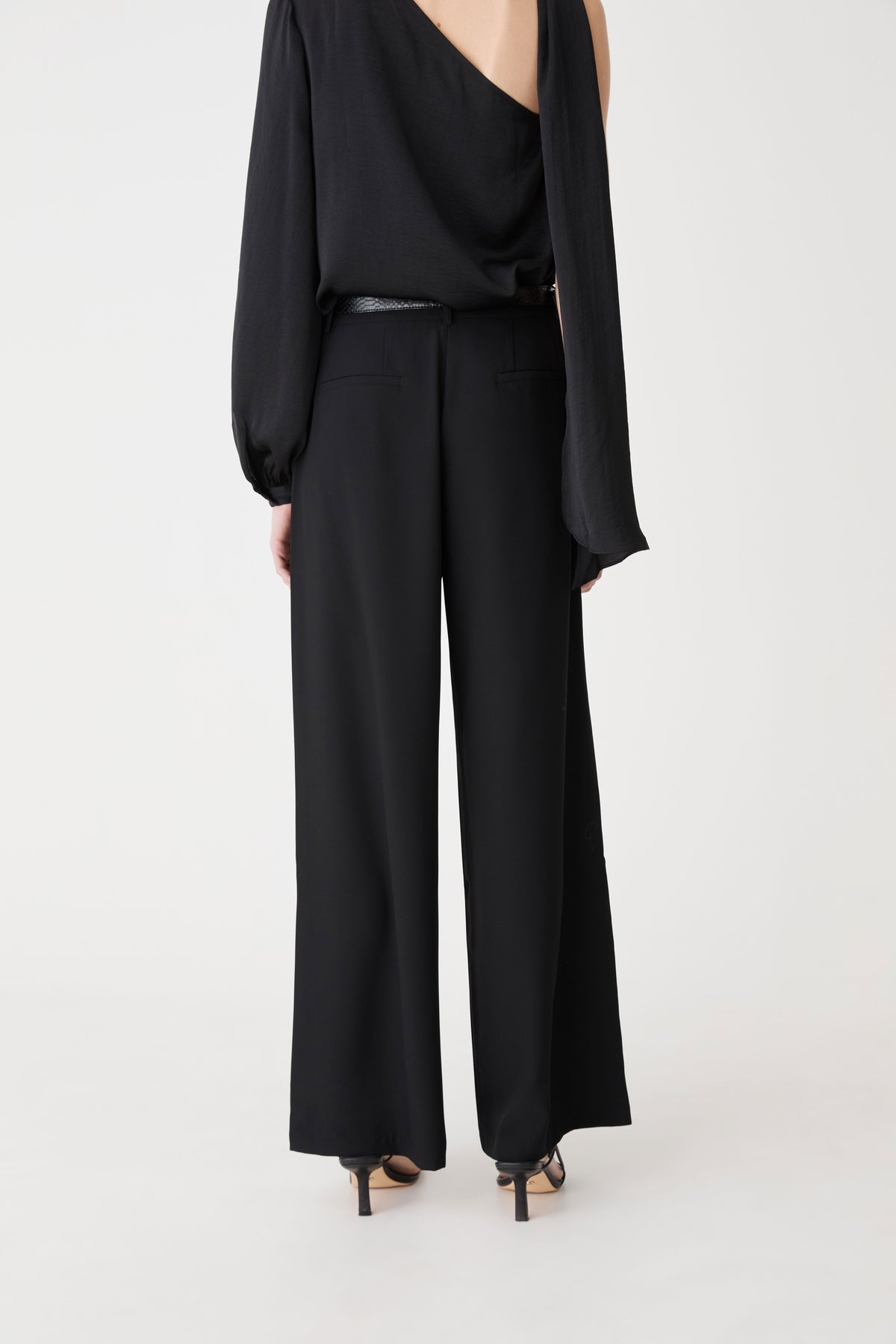 Daphne Pleated Crepe Pants in black — back view