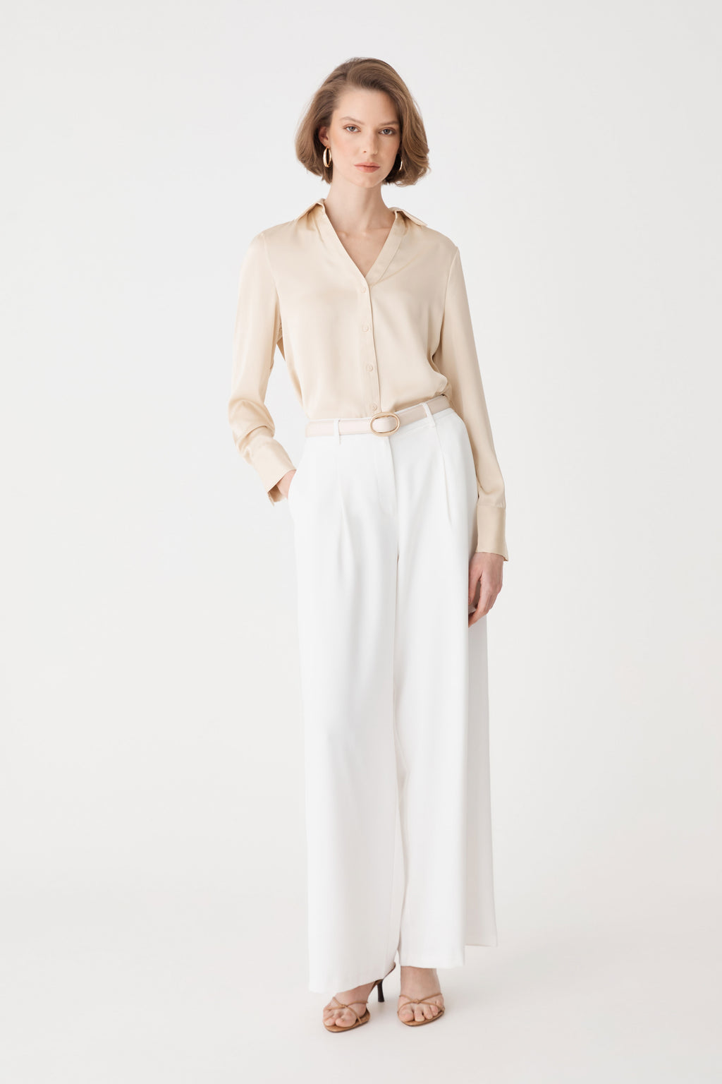 Daphne Pleated Crepe Pants in ivory, front view, worn with a beige shirt tucked in