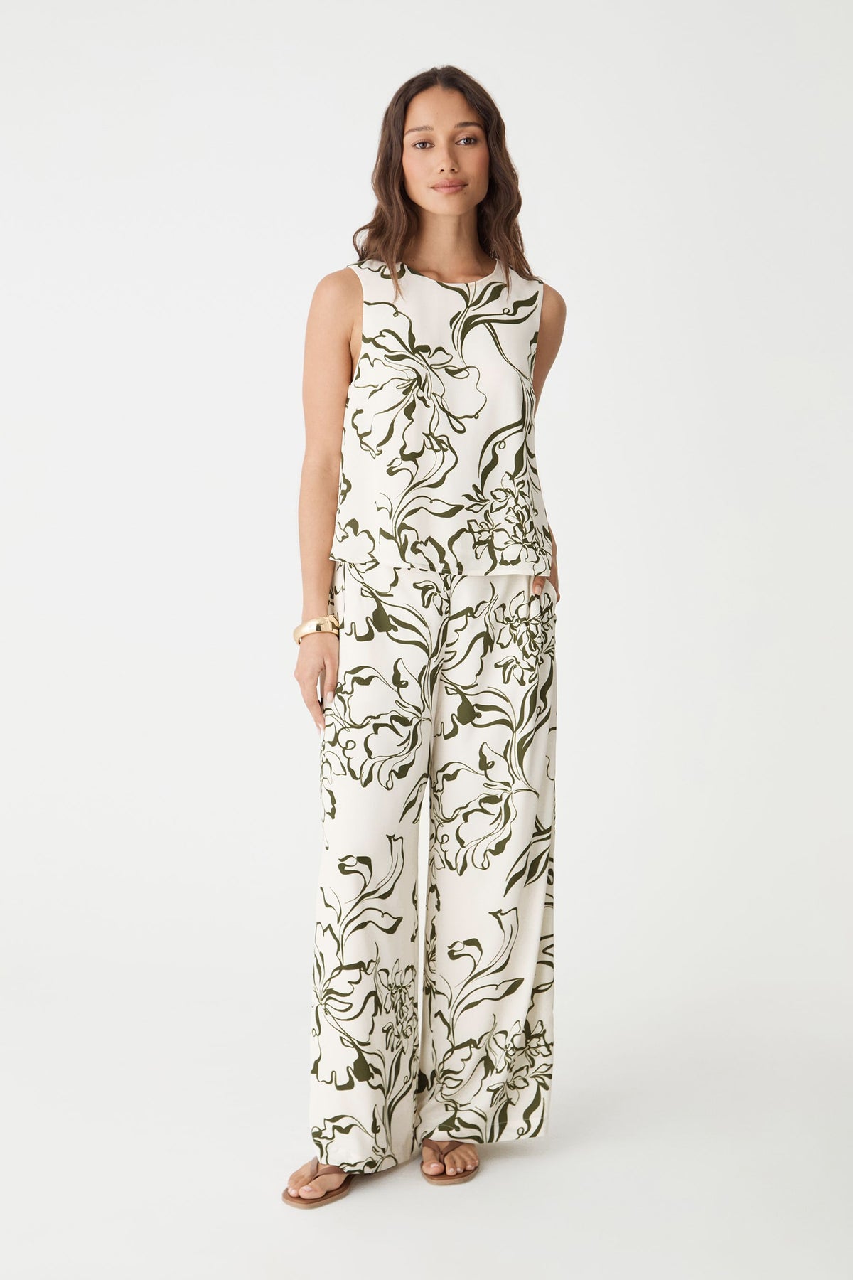 Natalie Elastic Floral Pants in ivory with olive botanical print, front view, worn with matching sleeveless top