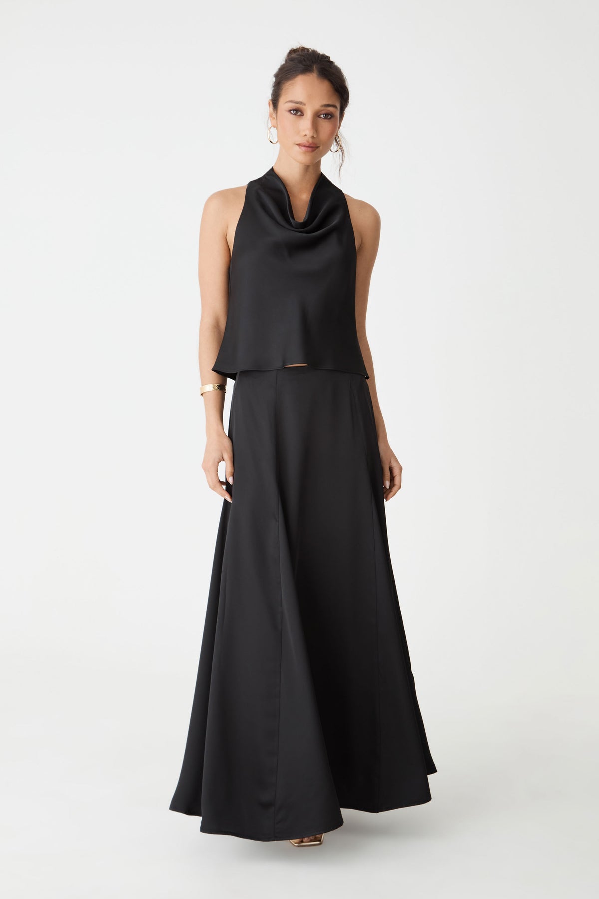 Freya Satin Godet Skirt in black, front view worn with a black cowl neck sleeveless top