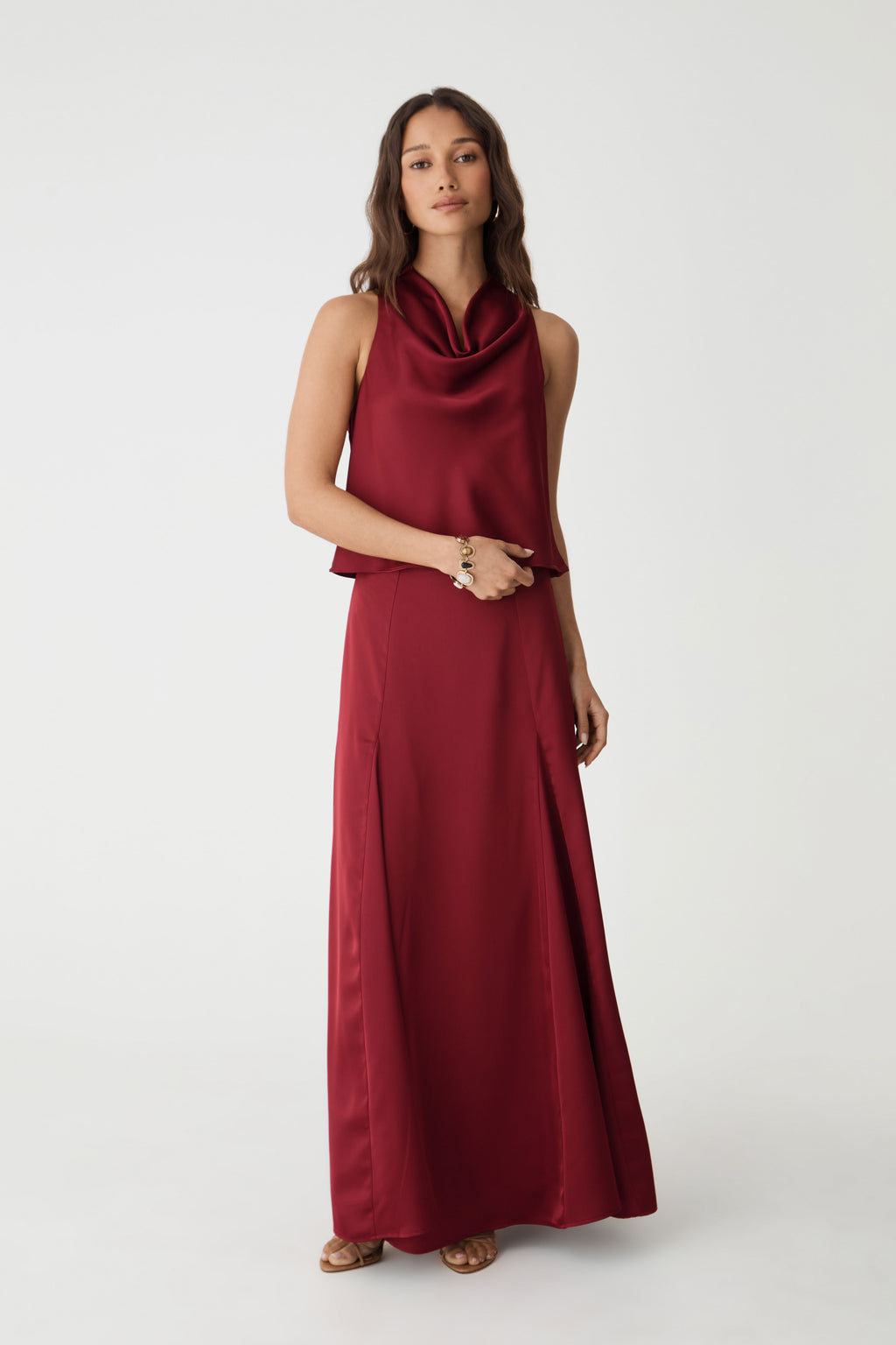 Freya Satin Godet Skirt in rhubarb, front view worn full length with matching cowl neck satin top