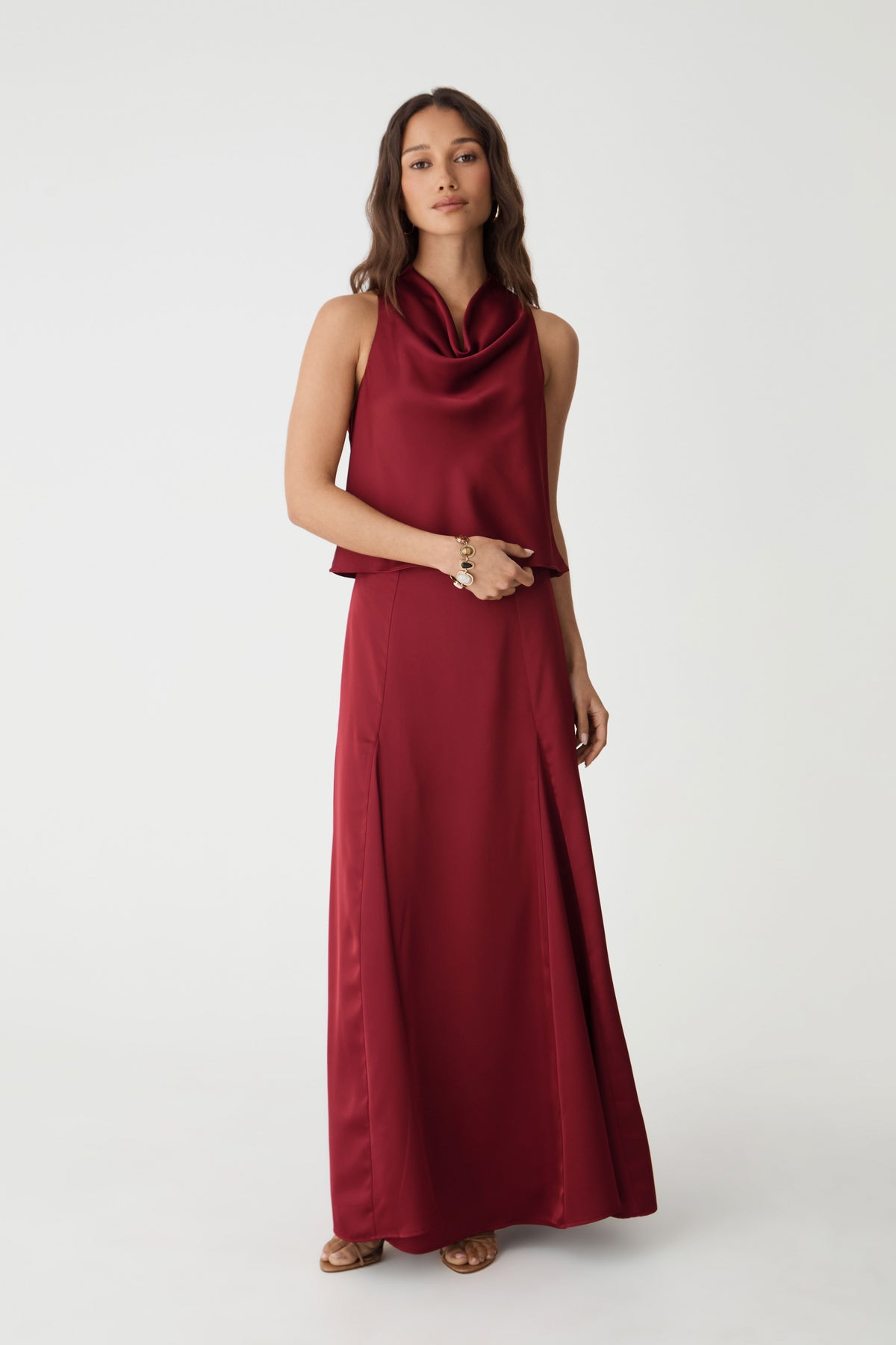 Freya Satin Godet Skirt in rhubarb, front view worn full length with matching cowl neck satin top