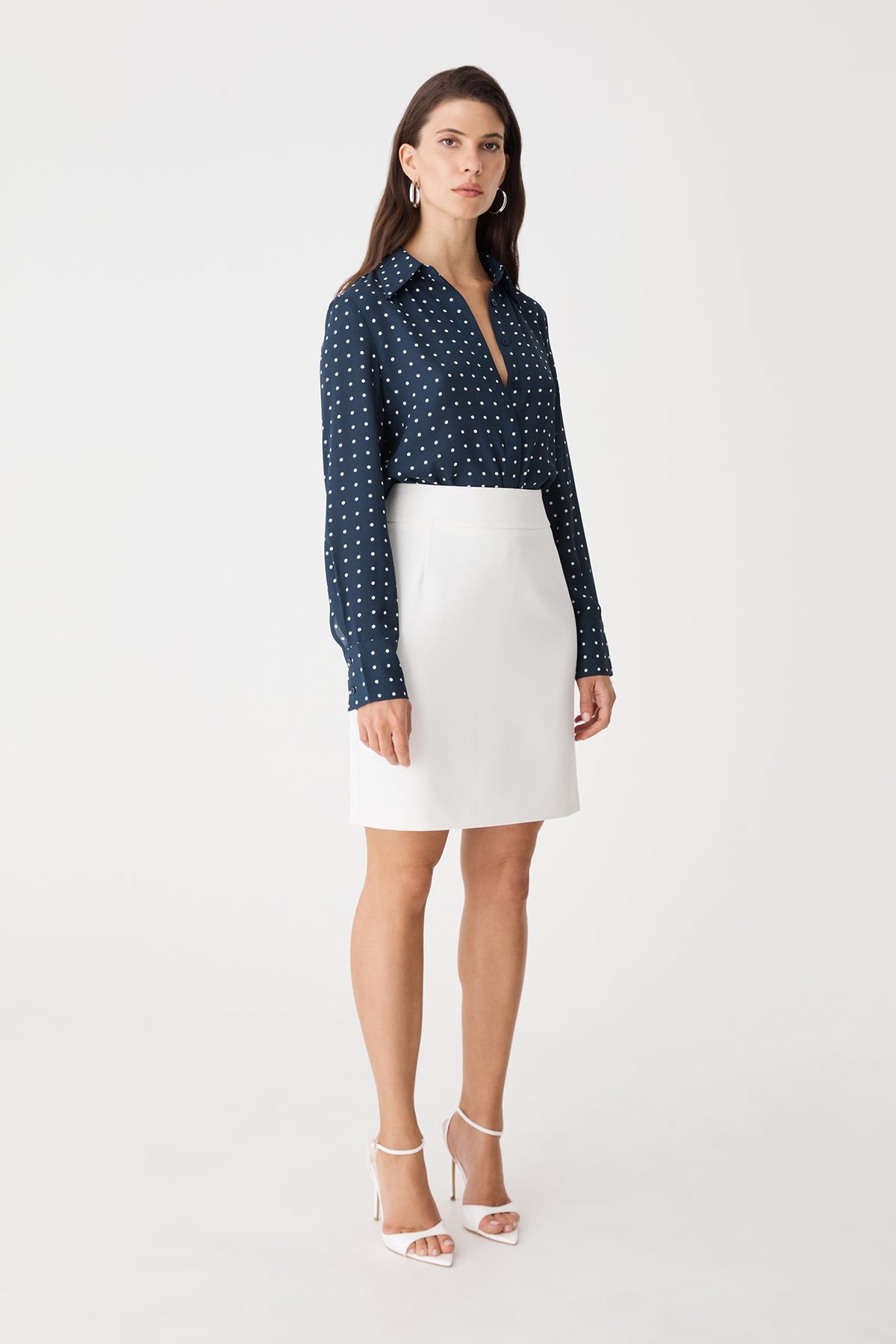 Side view of the ivory Lydia Short Straight Skirt with navy print shirt