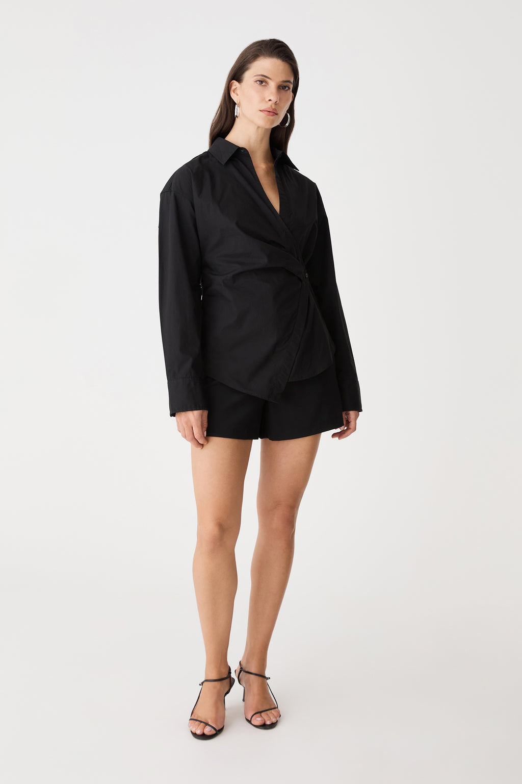 Front view of the black Katrina Wrap Shirt with long sleeves and dropped shoulders