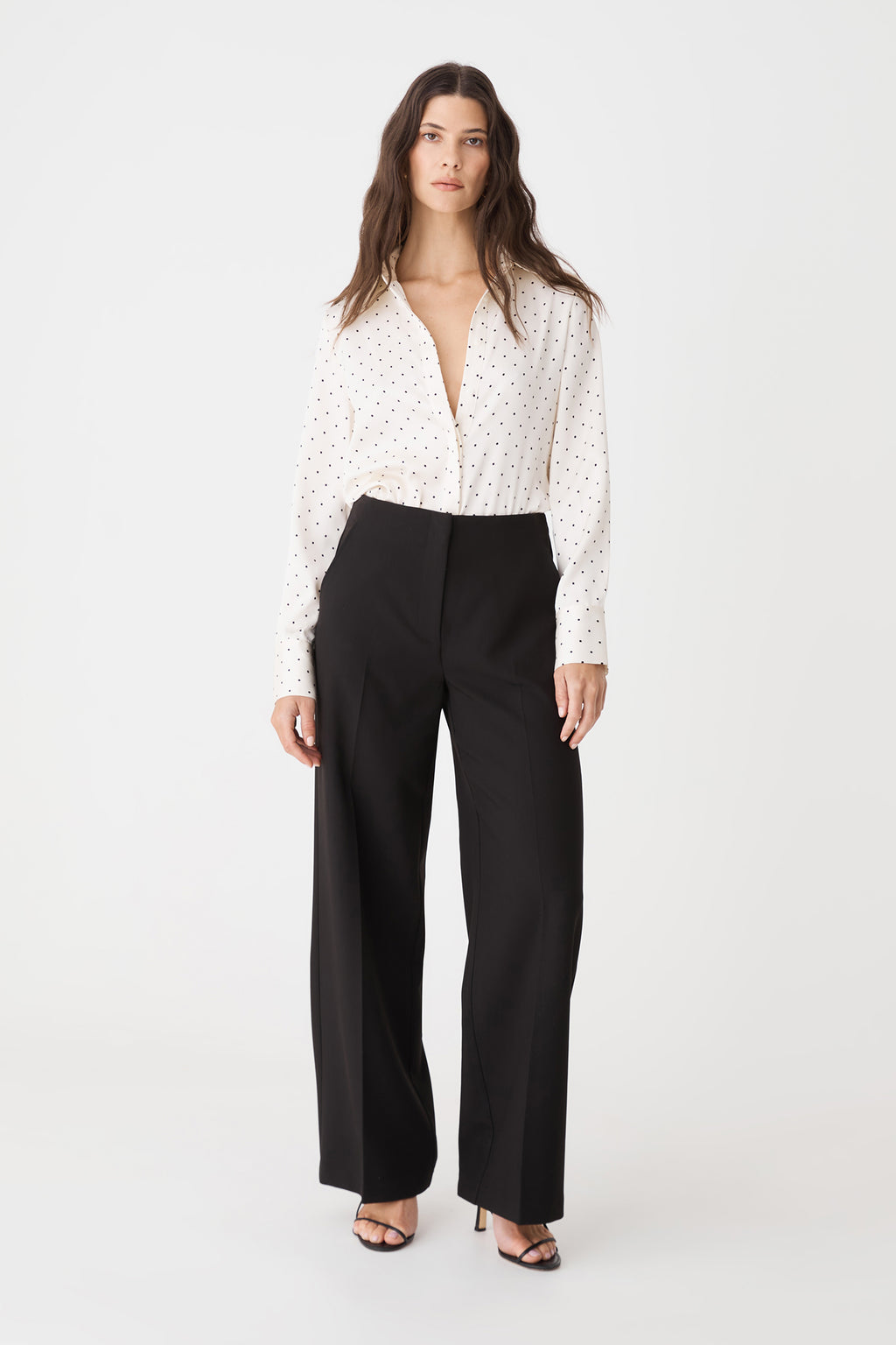 Courtney Satin Spot Shirt in Ivory & Black Dot, front view worn with black wide-leg trousers