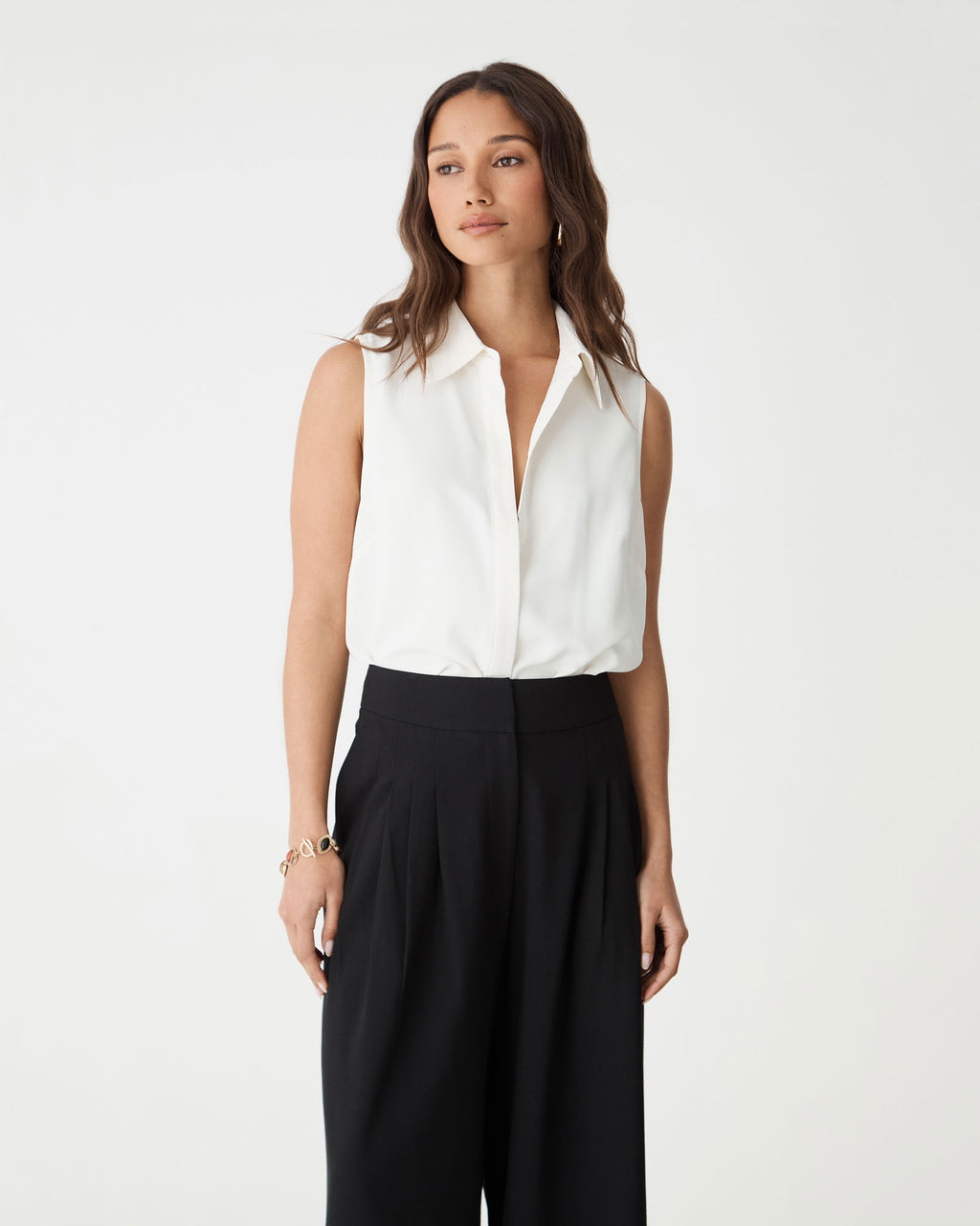Close-up front view of the ivory Brooklyn Sleeveless Shirt showing point collar and button placket