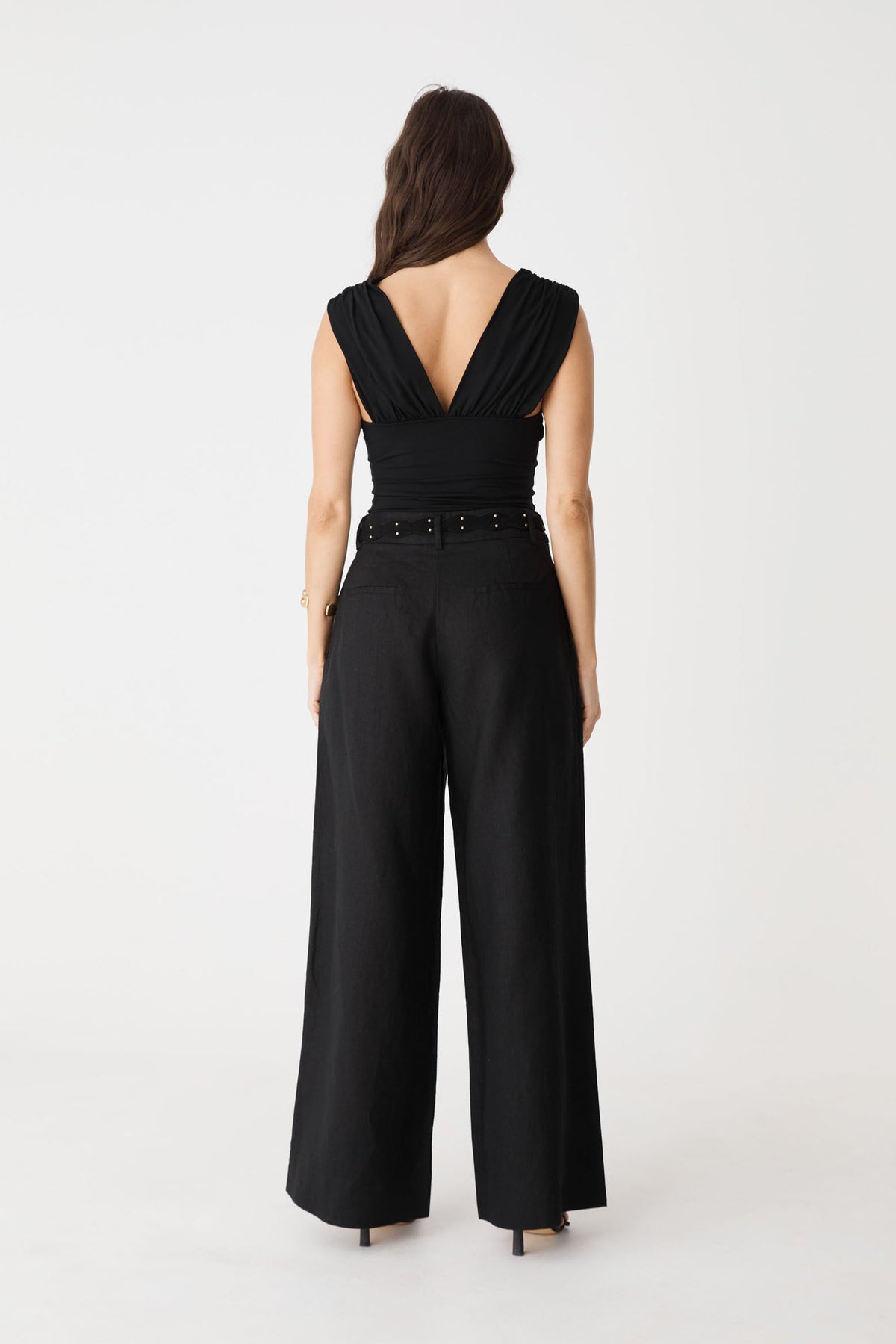 Back view showing the crossover back with gathered detailing in black