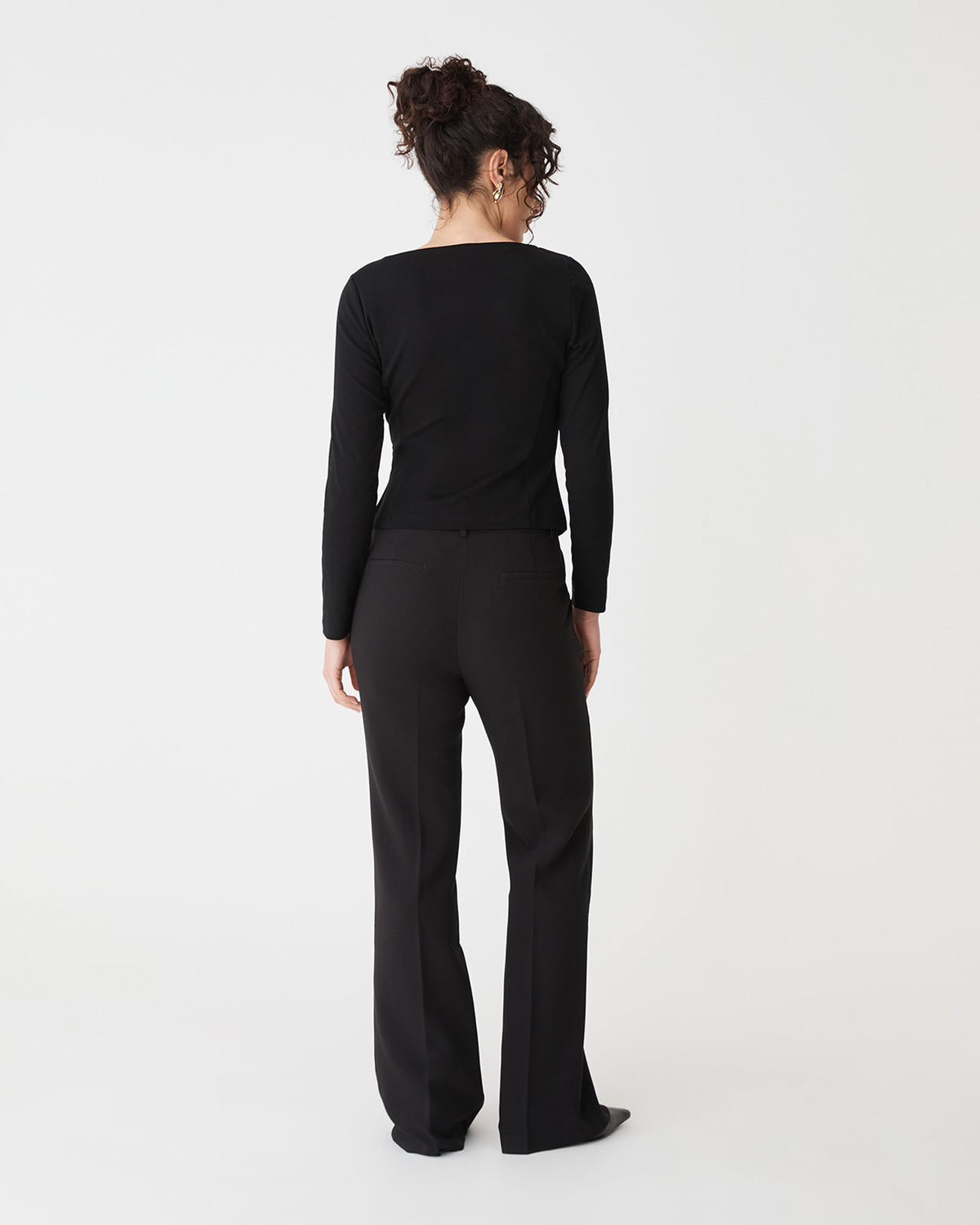 Calia Asymmetric Knit Top in black — back view